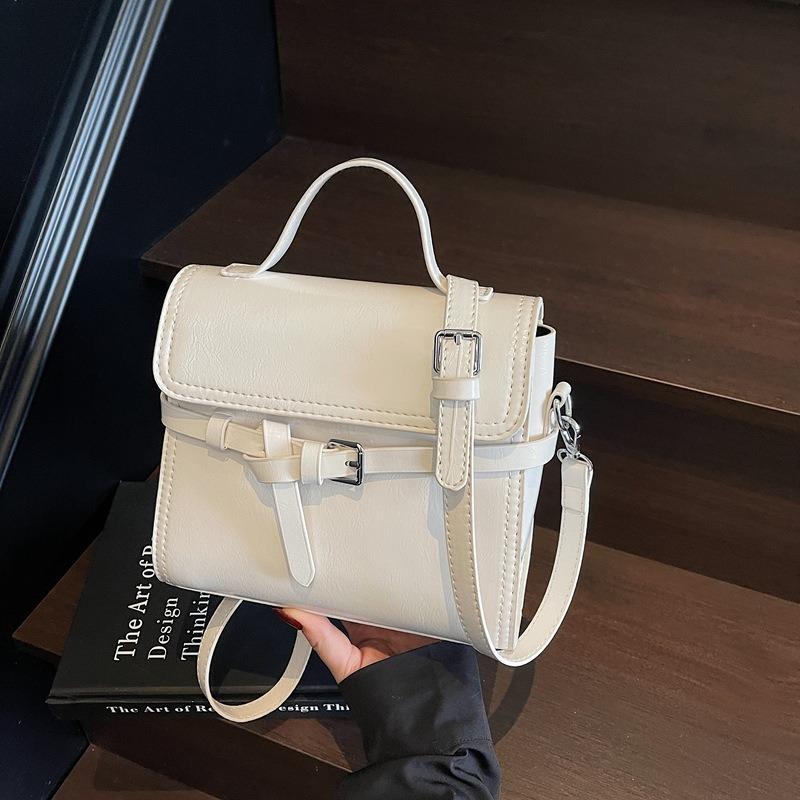 Trend niche high-end sense solid color versatile portable small square bag women's commuting simple oil wax leather messenger bag