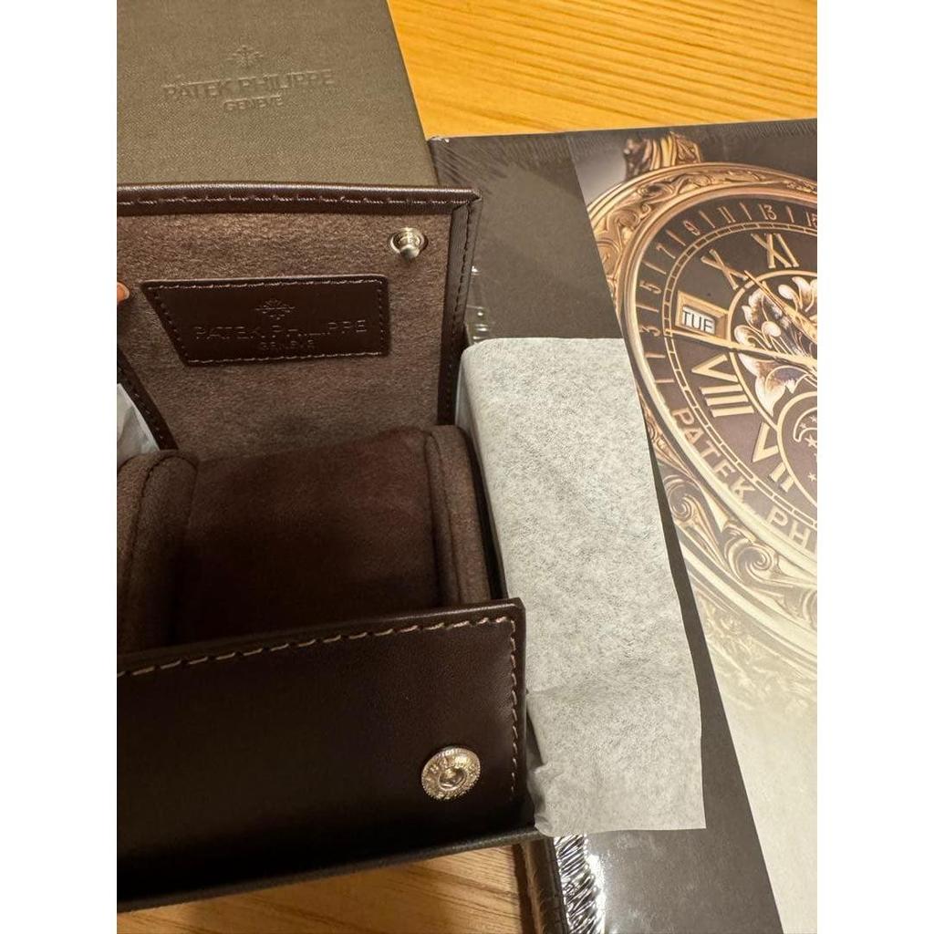 Used Patek Philippe collection book, 2 magazines, and travel case