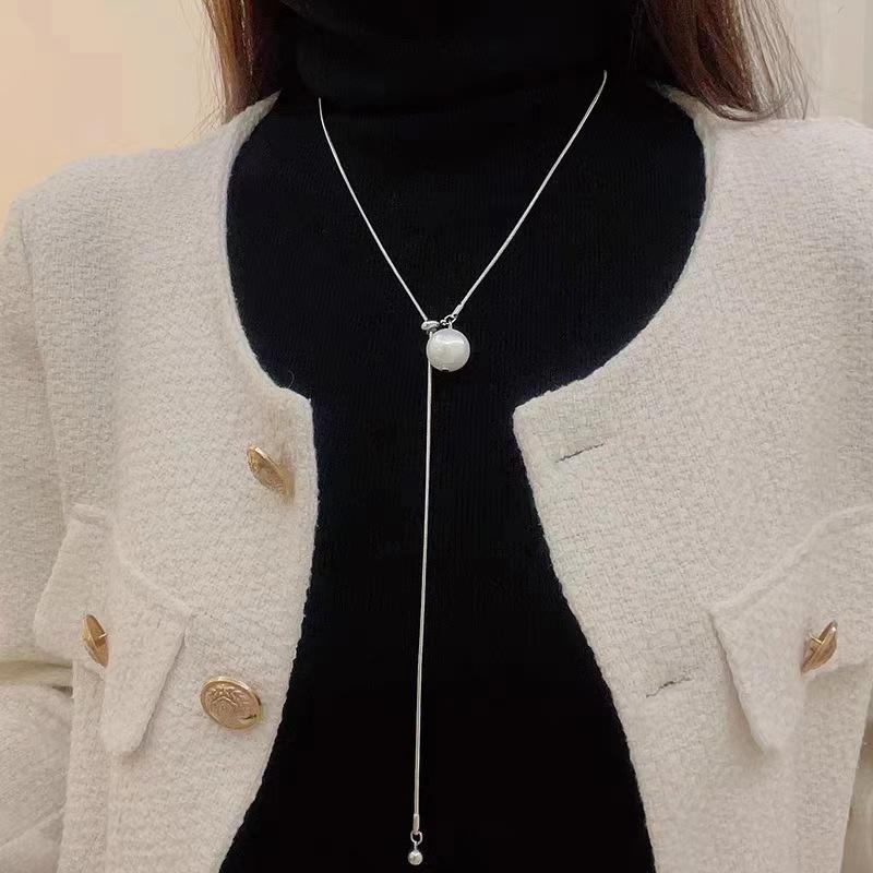 Korean Style Pearl Tassel Necklace: Versatile, Fashionable Long Pendant for Women's Summer Sweaters.
