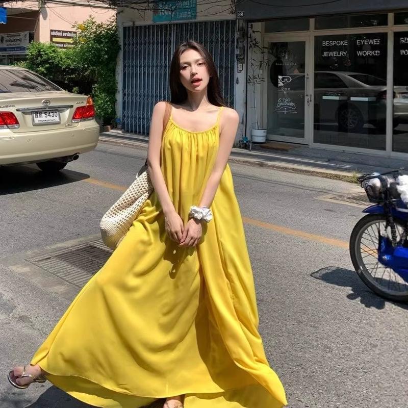 Seaside vacation sexy backless suspender dress women's summer new loose a-word skirt gentle yellow long skirt