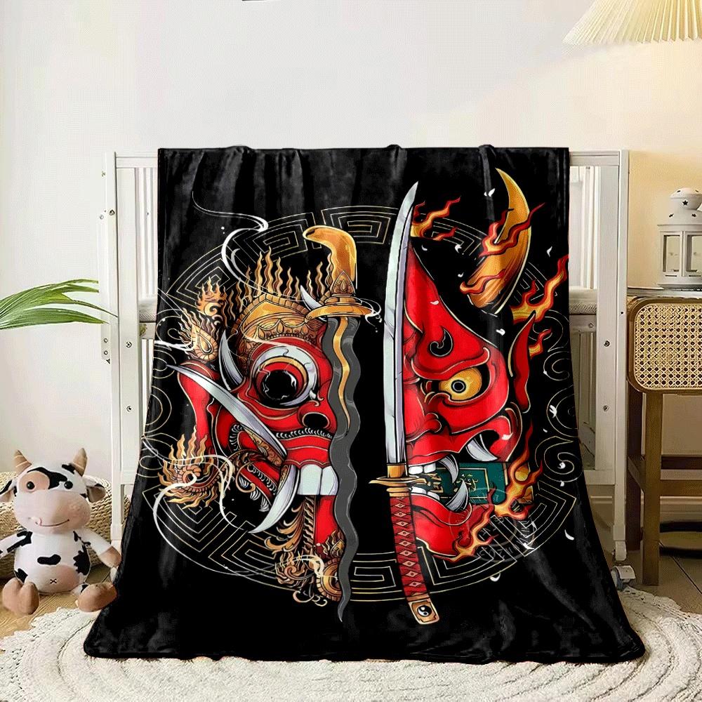 Fiery red demon masks split by swords, surrounded by ornate golden designs. for all seasons blanket lunch break throw gift