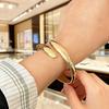 Niche Embrace Gold Alloy Water Drop Bracelet for Women – Luxury Irregular Mirror Finish Stackable Bangle