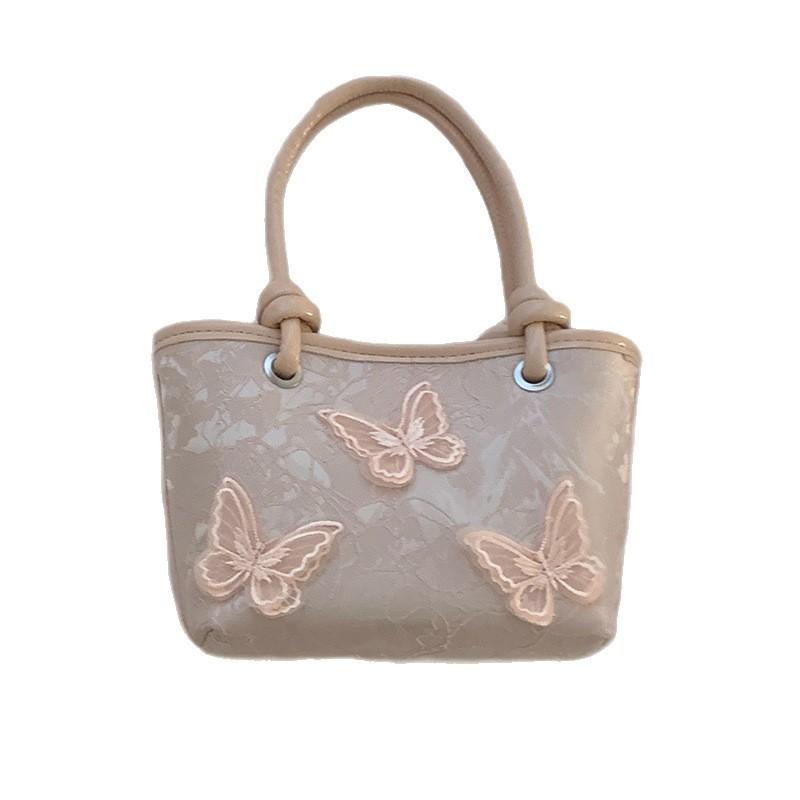 Niszowa torebka pod ramię damska nowa moda niszowa przenośna mała torba tote na ramię listonoszka