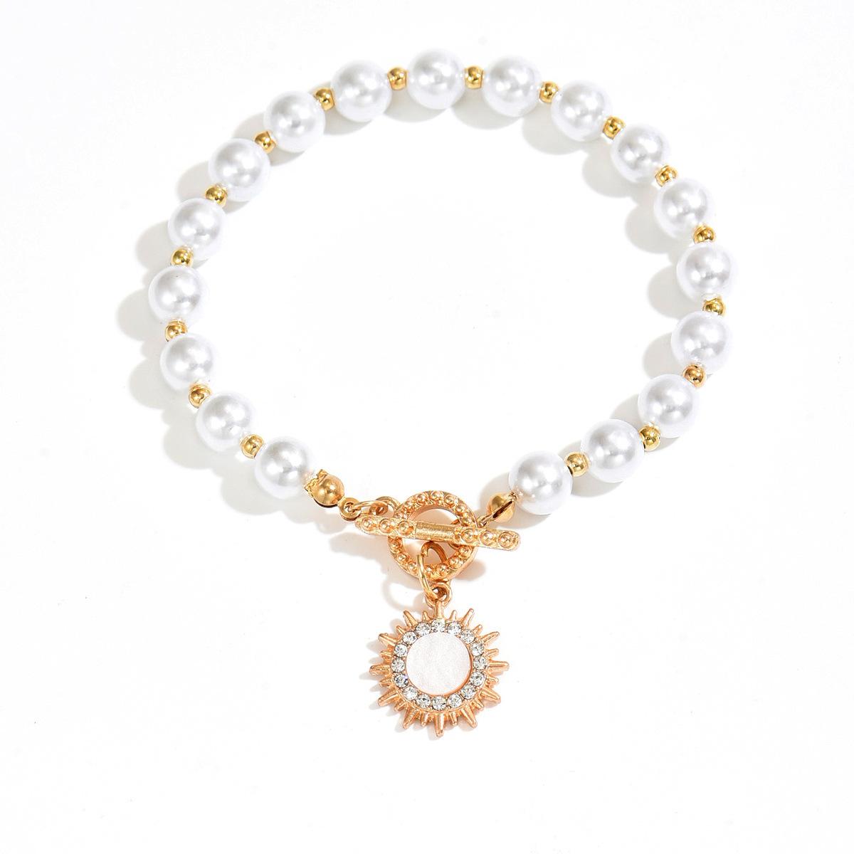 

European and American light luxury retro imitation pearl necklace cold wind temperament simple diamond setting sun pendant earrings bracelet