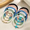 Bohemian style cross colored bead bracelet with multiple pieces of stacked women's bracelet set
