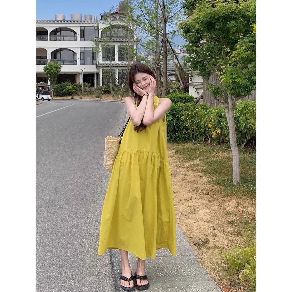 French yellow neck off-the-shoulder dress for women's summer new Yunnan seaside vacation travel temperament loose medium and long dress