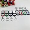 Ouvre-bouteille LED Multifonctionnel Mini Lampe de Poche Illuminée Porte-clés Pendentif