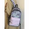 Large-capacity contrasting color plaid junior high school backpack, new student commuting light schoolbag, versatile computer backpack