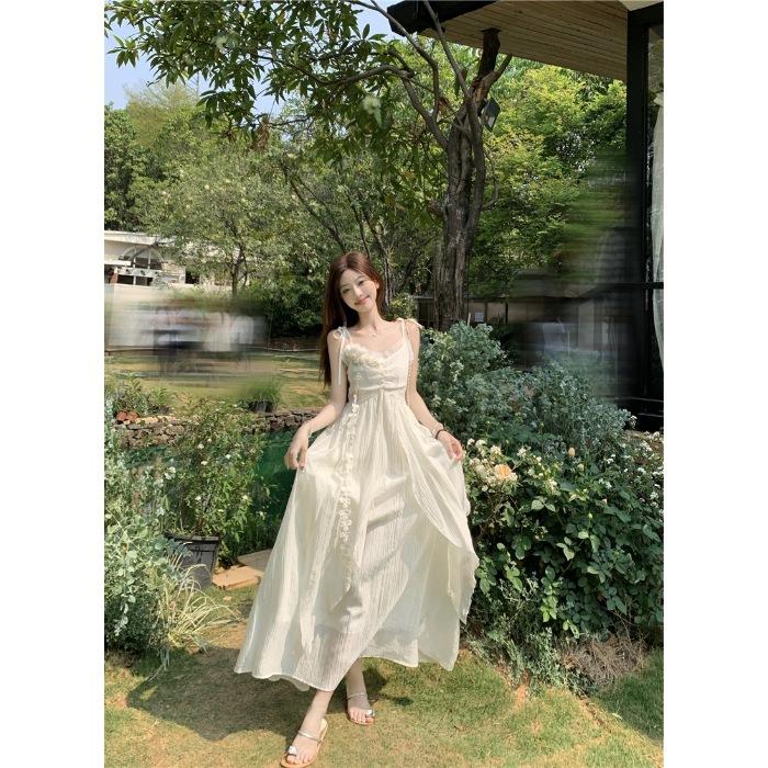 Holiday style flower design suspender dress women's 2026 summer new waist thin very fairy long skirt