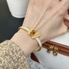 The same sand gold filament inlaid with point diamonds butterfly bracelet in the gold store, women's imitation gold.