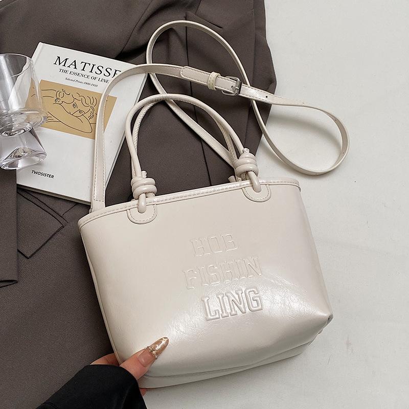 2025 popular new niche simple wind hand carrying bucket bag Korean version casual versatile commuter fashion messenger bag women