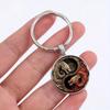Yin Yang Dragon Keychain - Sleek Alloy Pendant with Intricate White and Red Dragon Design, Perfect Accessory.