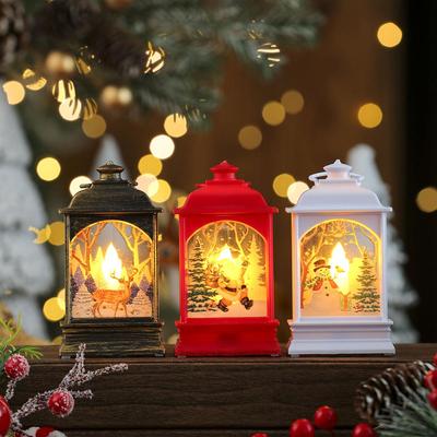 Lumières de lanternes de Noël transfrontalières: Décorations de Noël à la bougie et bonhomme de neige