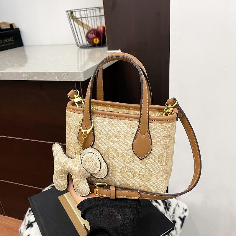 

Niche design retro handbag women s new high-end versatile shoulder messenger bag bucket bag коричневый