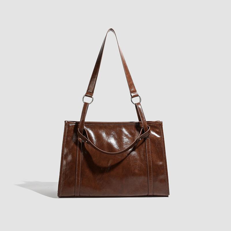 

Fashion portable large bag women s bag new fashion simple large capacity shoulder bag casual commuter tote bag темно-коричневого