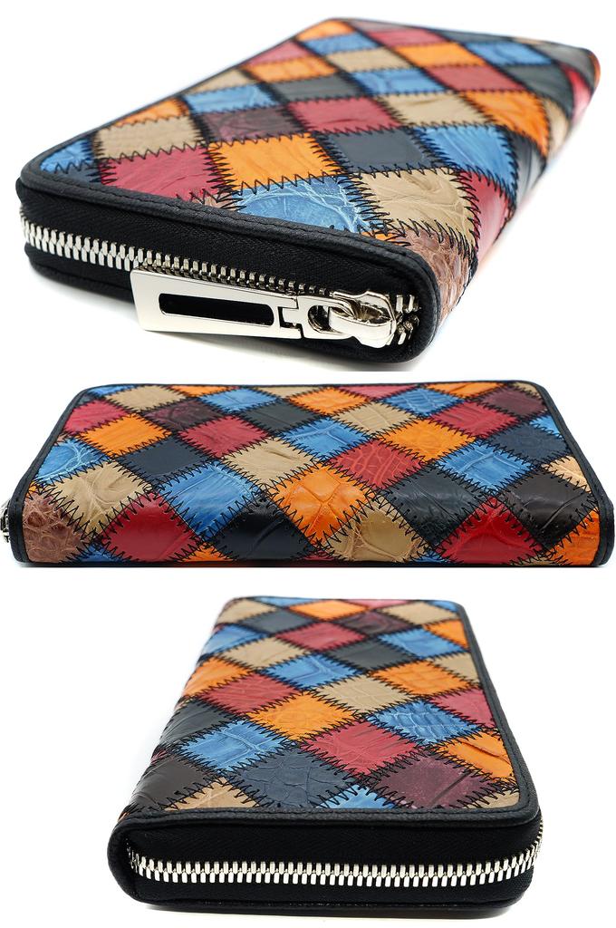 Pomarańczowy długi portfel dla mężczyzn i kobiet, wykonany z jednego kawałka prawdziwej skóry krokodyla. Posiada złote okrągłe zapięcie na zamek błyskawiczny, portmonetkę na monety, dużą