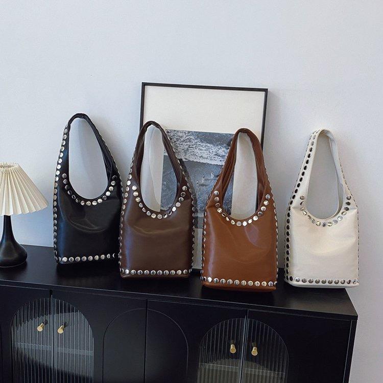 

European and American retro large-capacity tote bag, bucket bag, polka dot rivet underarm bag, portable women s bag, women s shoulder bag. One size