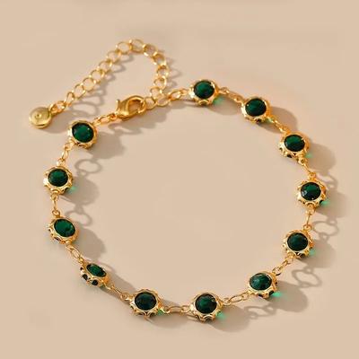 Wearing a Vintage Style Copper Plated 18K Gold French Bracelet On the Beach In Summer