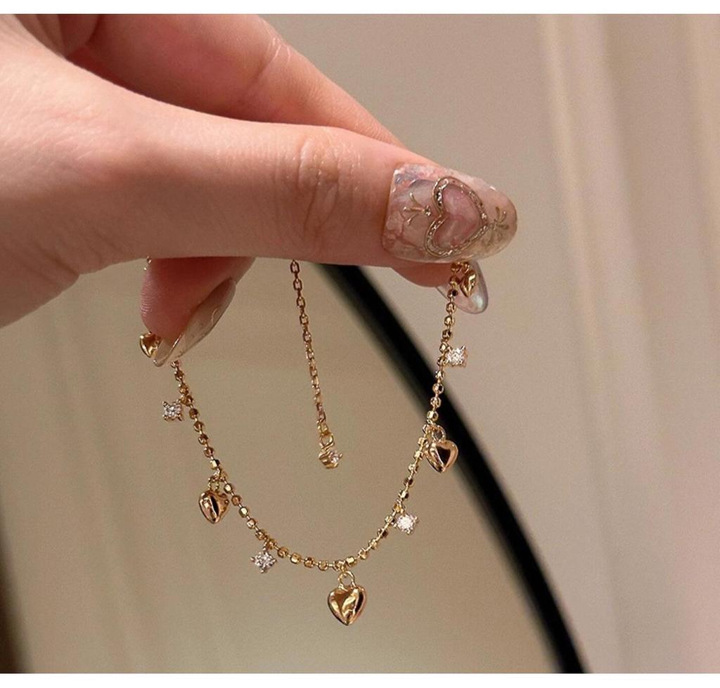 Elegant French Retro Heart Tassel Diamond Pendant Bracelet - High-End Fashion for Women.