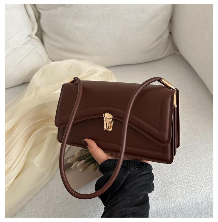 

Французская нишевая сумка подмышкой для женщин 2024 года корейская версия новой модной фактурной сумки через плечо маленькая квадратная сумка темно-коричневого