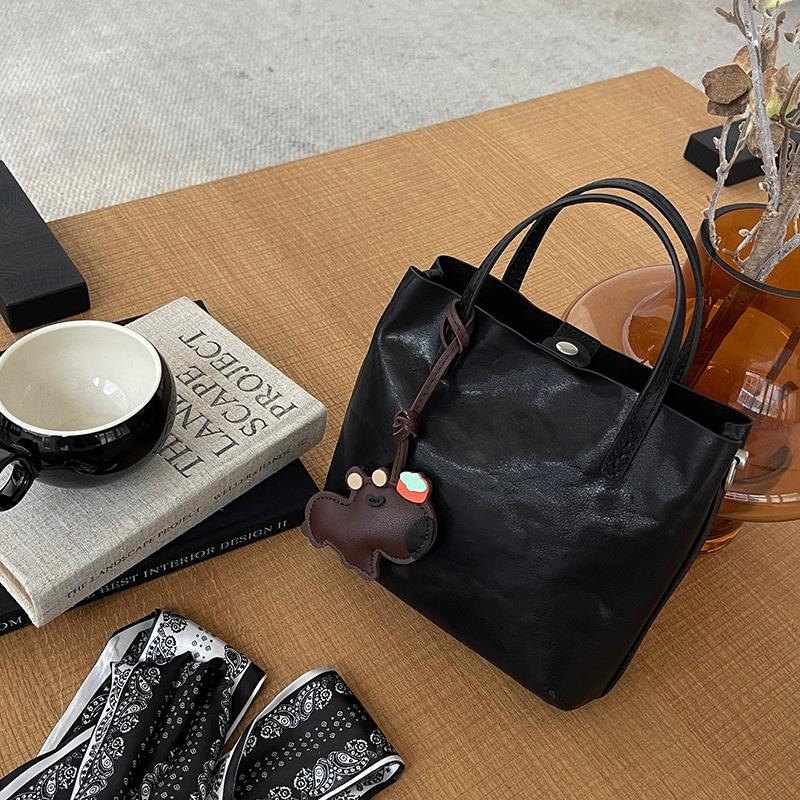 

Vegetable tanned cowhide bucket tote bag women s 2026 new leather handbag retro high-end shoulder messenger bag 20X7X18CM чёрный