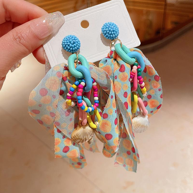 

Steel needle bow rice ball earrings niche fashion atmosphere earrings personality small fresh holiday style earrings