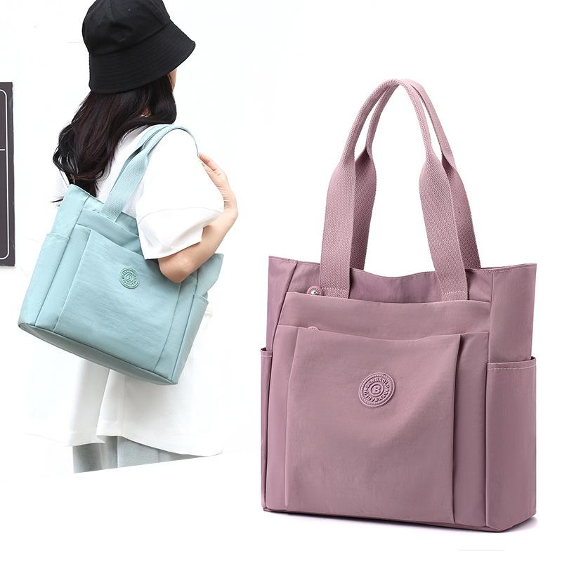 Lässige Damentasche Wind Sommer Große Kapazität Lässige einfarbige Nylontuch-Schulter Tragbare Muttertasche