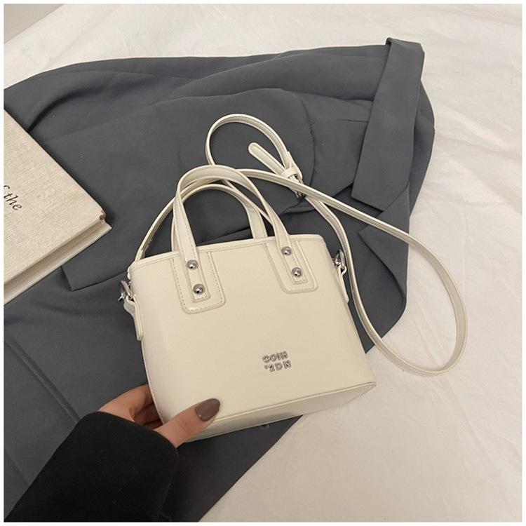 

Premium hand carry pleated pattern bag 2025 spring new fashion women s bag simple bucket bag glossy messenger bag