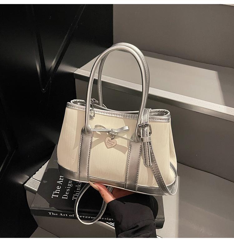 

New portable bucket bag women s 2025 summer contrasting color splicing advanced texture simple shoulder messenger bag
