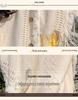 Cardigan da donna bohémien con cappuccio e nappe
