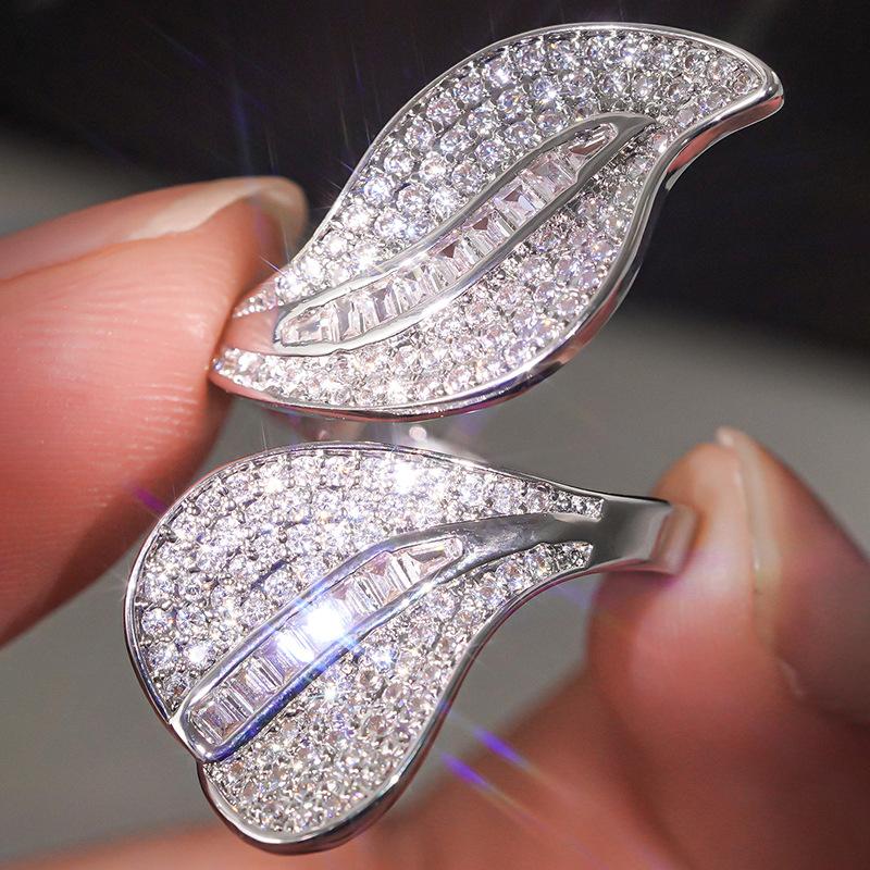 

2026 New Alien Asymmetric Leaf Ring for Women with Elegant Design, Trendy Personality, Adjustable Opening, Exaggerated Ring resizable