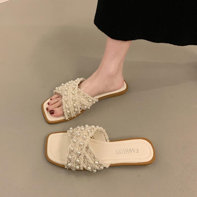 

Cross slippers women s summer outer wear 2025 new pearl fashion flat bottom not tired feet non-slip beach small fragrant sandals 35