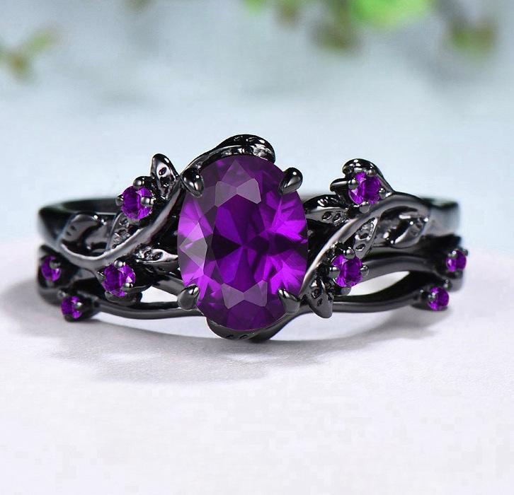 Bague bicolore noire et dorée avec zircon triangulaire vert olive