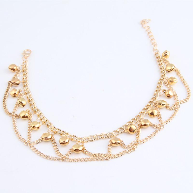 Bracelet de cheville bohème à pompons ondulés dorés pour la plage et l'été