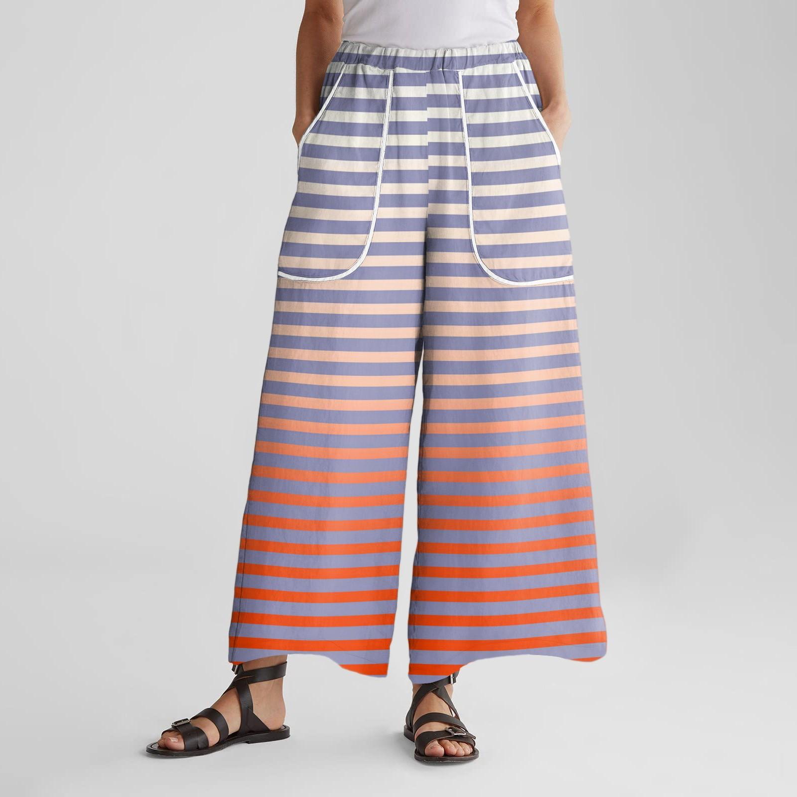 

Женские брюки широкие от бедра с эластичным поясом, с принтом, с большими карманами, с отделкой пэчворк по краю, свободные M