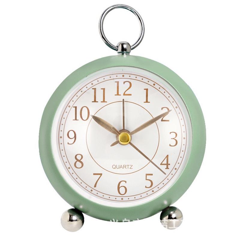 Silent Metal Alarm Clock with Night Light and Gold Stamped Spherical Face - Perfect for Students and Children.