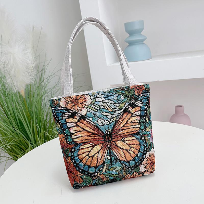 

Новая двусторонняя жаккардовая вышитая сумочка, ручная сумка, жаккардовая вышитая тканевая сумка с бабочками