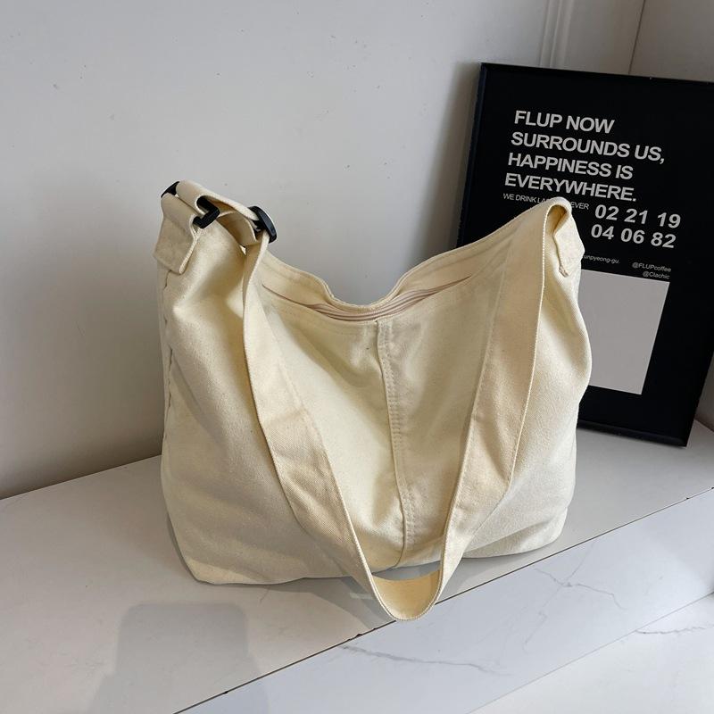 Bag women's new bag high-end canvas dumplings fashionable large-capacity shoulder messenger bag