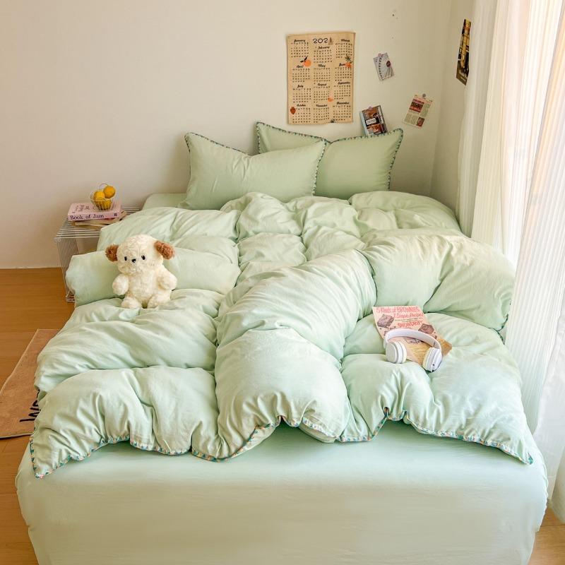 Literie Class A 2025 nouveau vent crème couleur unie drap de lit ensemble quatre pièces housse de couette étudiante ensemble quatre pièces ménage