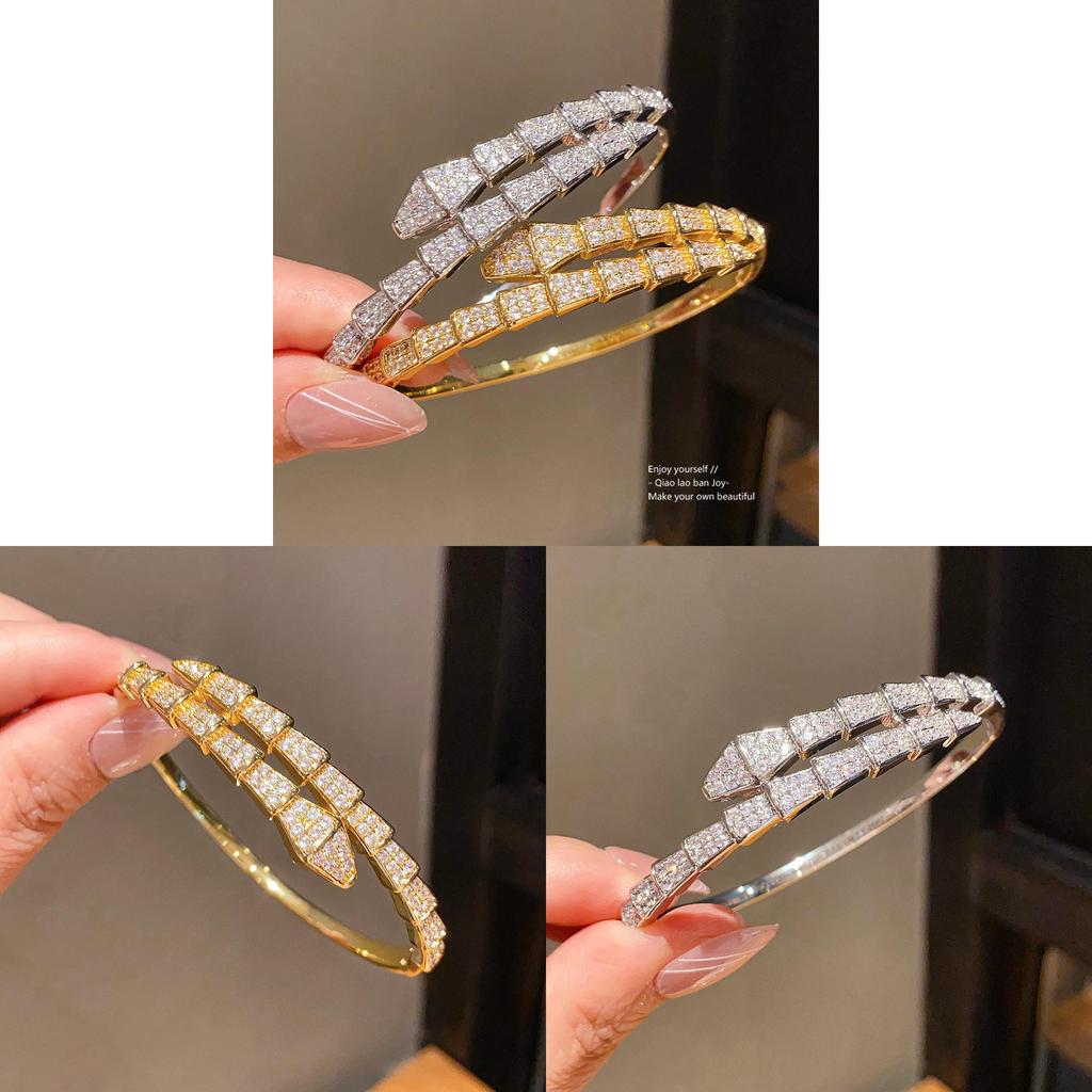 Bracciale di lusso a forma di serpente in rame placcato oro con accenti di zirconi per fashioniste