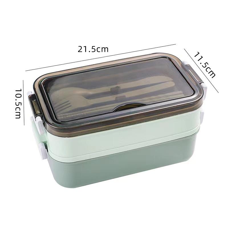 Dwupoziomowy lunchbox z przegródkami Zawiera widelec/łyżkę Łatwy do czyszczenia Wygodny w użyciu