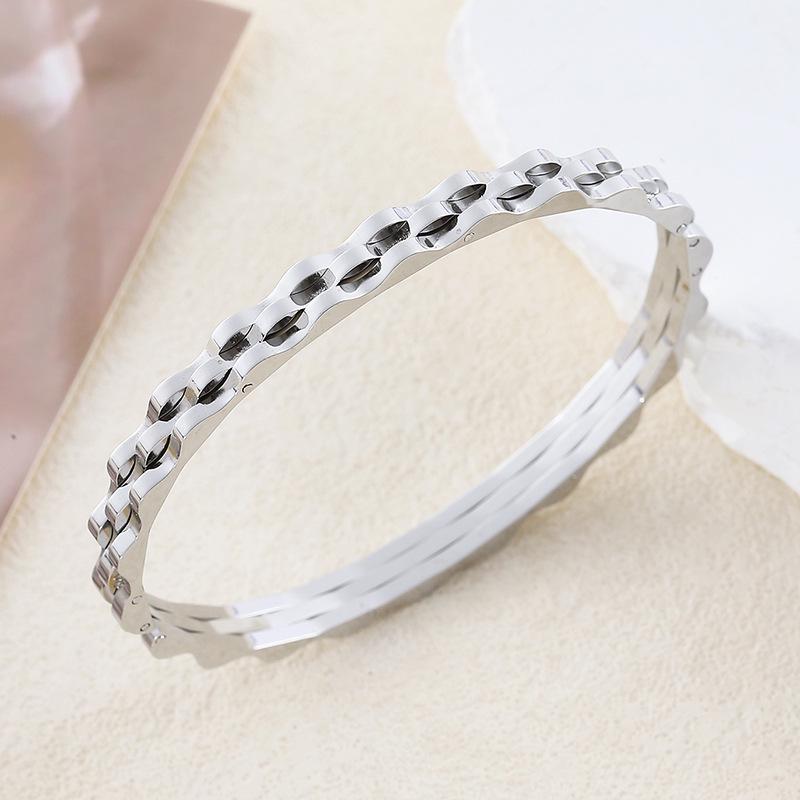 European American Titanium Steel Wave Bracelet: Elegant Women s Stainless Steel Bangle Jewelry.