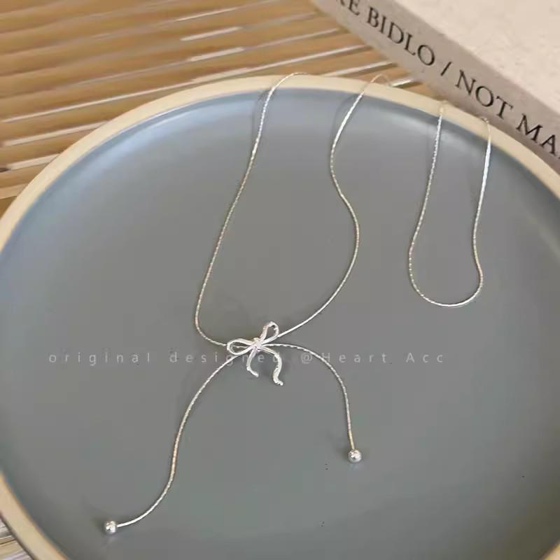 Silver Bow Tassel Pull-Out Necklace: 2025 Trendy & Elegant Clavicle Chain