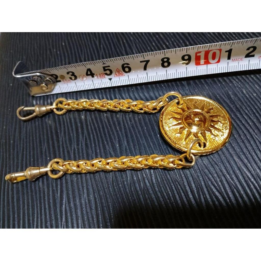Used Golden Charm with Sun Motif