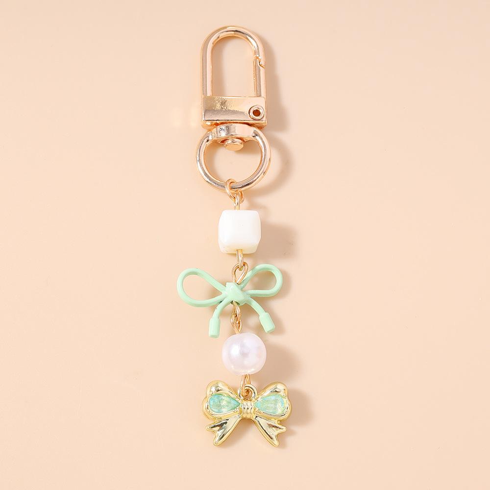 

Feminine Key Ring Elegant Sweet Heart Charm Key Ring Cute Keychain High-Quality Bow Pearl Keychain For Gifts Key Organizer Bag