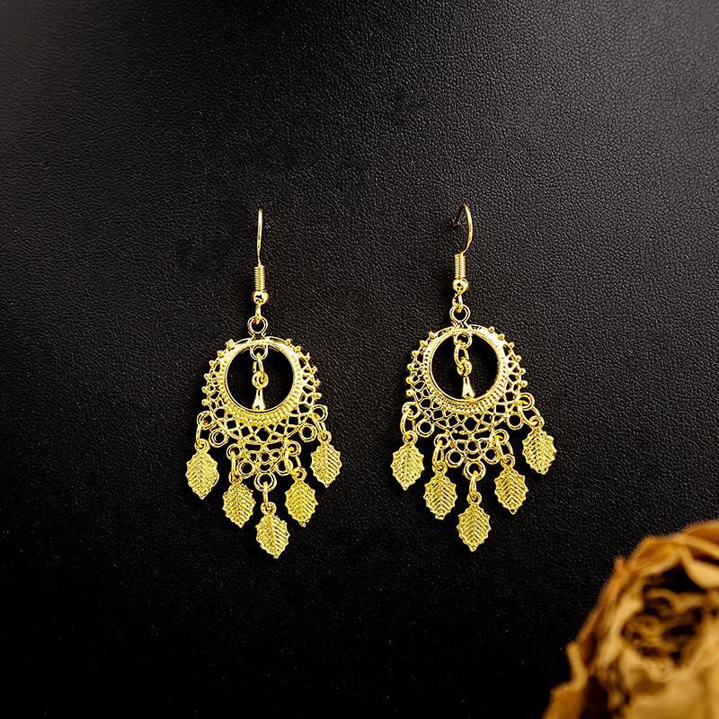 

Серьги-колокольчики с кисточками в виде павлина и подвеской в виде листа в стиле бохо