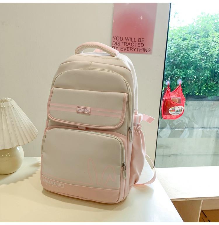 

New female versatile fresh junior high school high school college student leisure travel backpack large capacity primary school schoolbag рожевий
