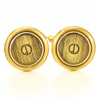 Použité manžetové knoflíčky Dunhill kovové pozlacené