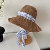 Spring and summer girl atmosphere plaid lace-up woven straw hat sunscreen sunshade seaside vacation wind show face small brim