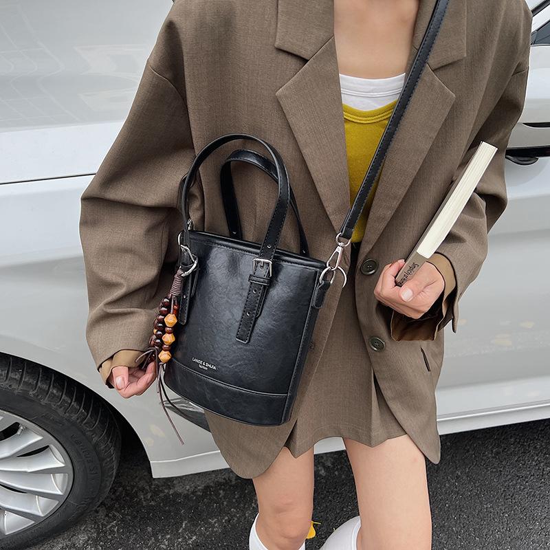 

Премиальная нишевая сумка женская осень-зима 2025 новая ретро леопардовый принт сумка через плечо мессенджер женская портативная сумка-ведро чёрный